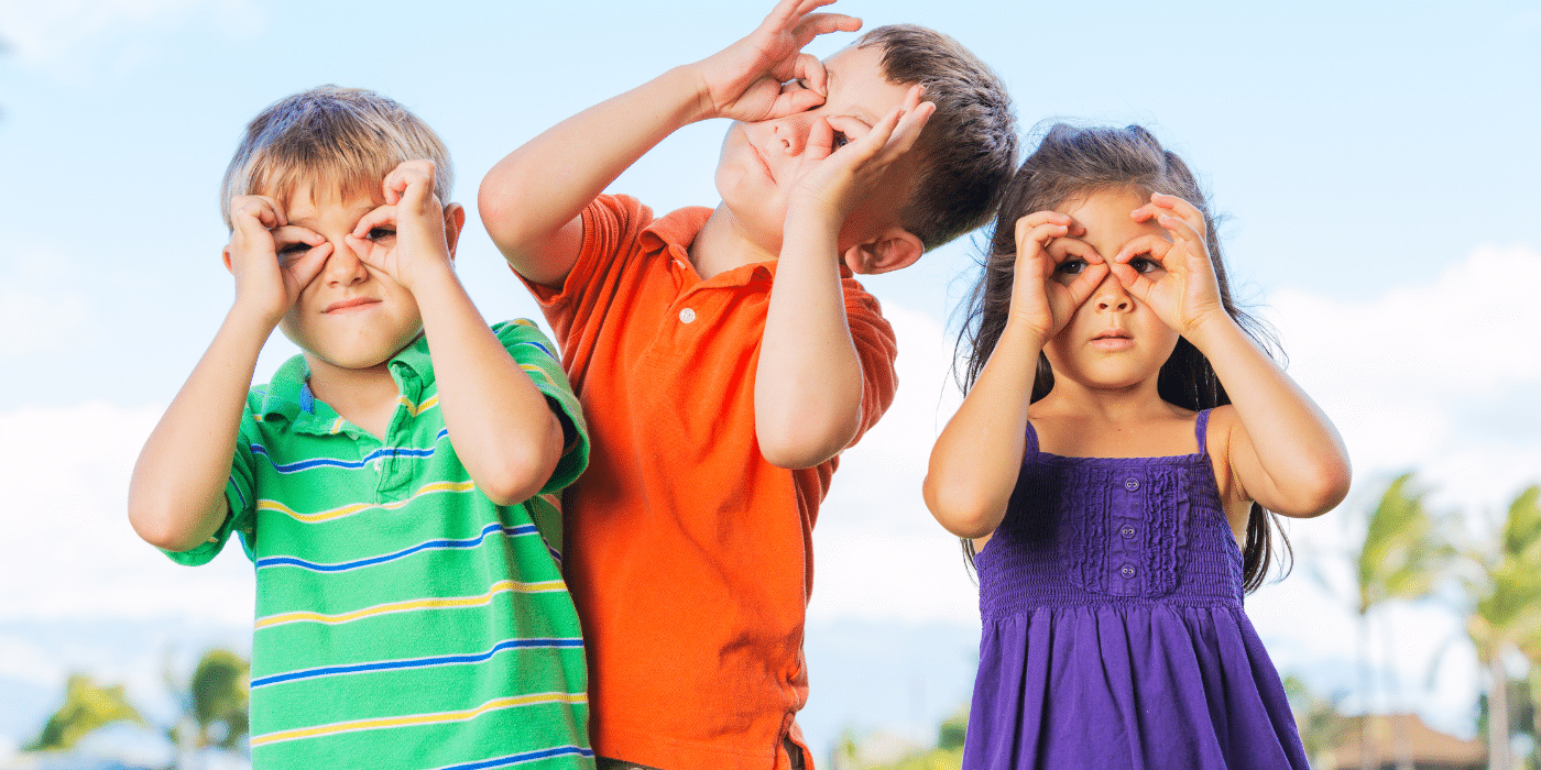 Kids wearing imaginary glasses with fingers