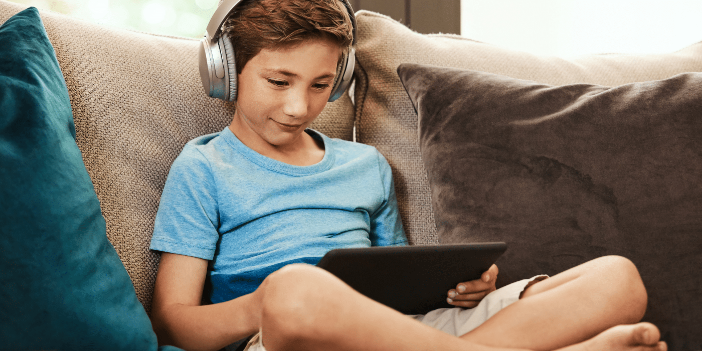 child viewing digital tablet