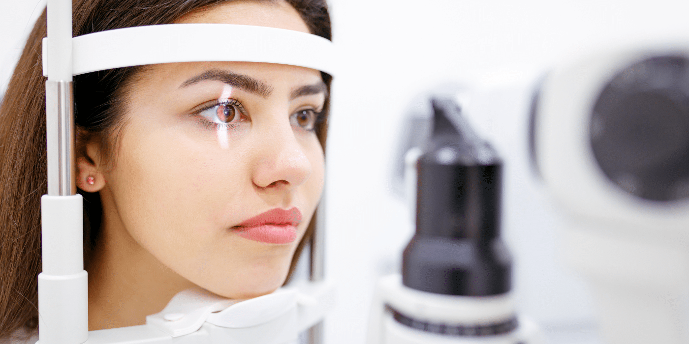 young woman getting eyes examined