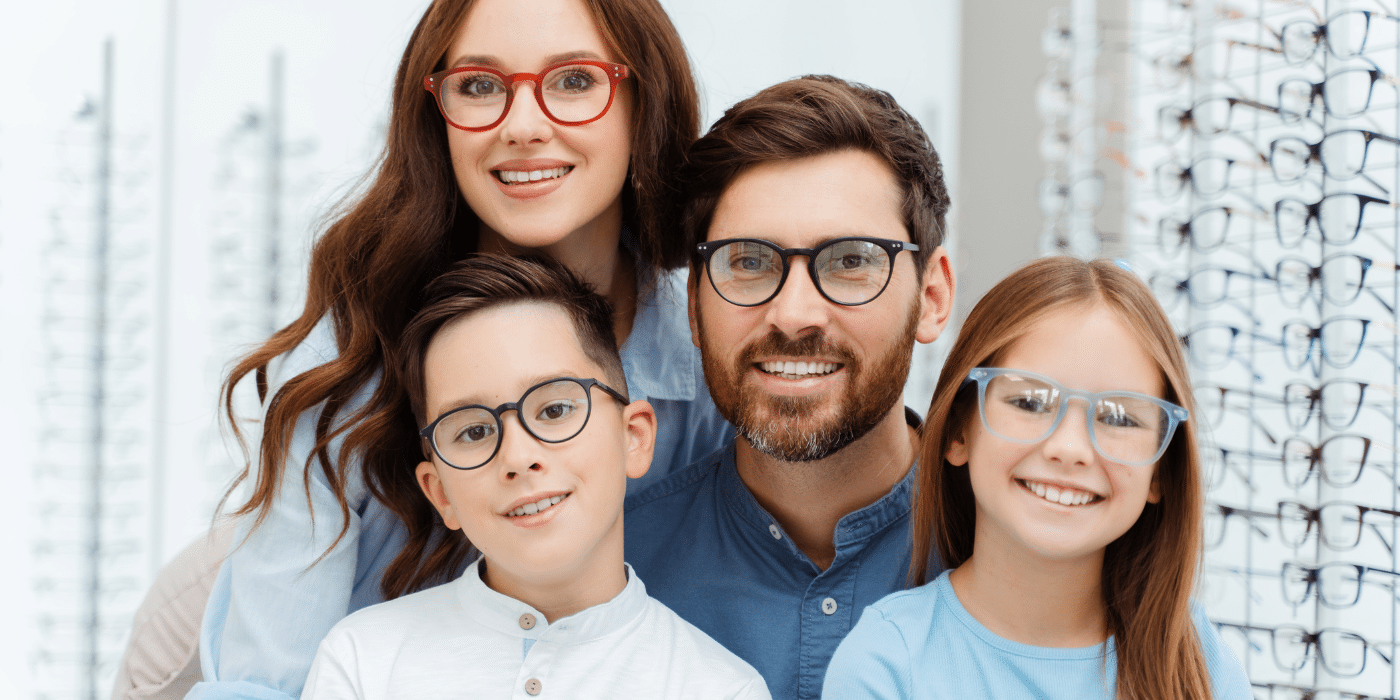 family of 4 wearing glasses and having healthy vision